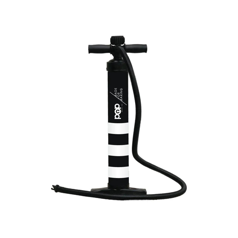 A black and white dual action hand pump with a hose, designed for inflating and deflating inflatable paddleboards and docks.