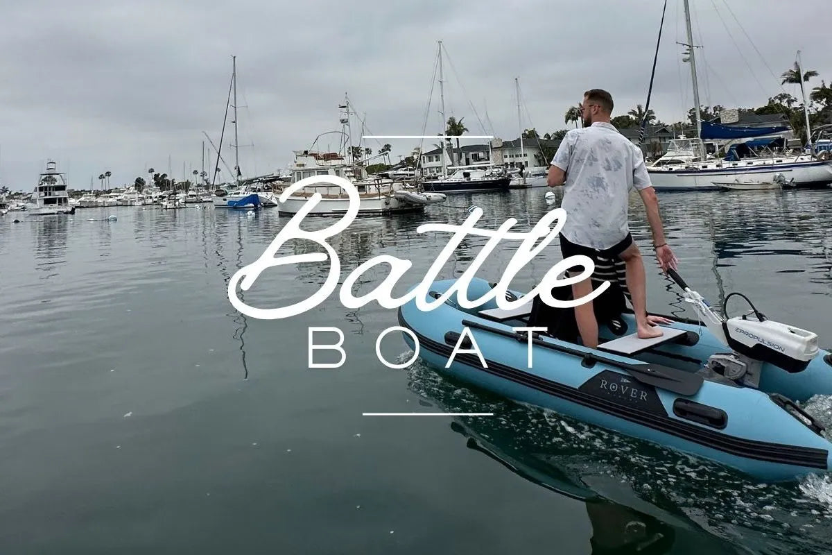 Person on a small boat in a marina with 'Battle Boat' text overlay