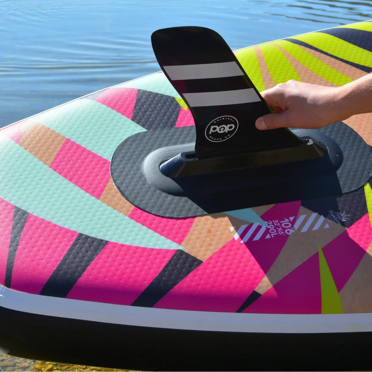 Close-up of removable fin system on POP Royal Hawaiian 10’6 inflatable paddleboard.
